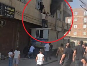 Yangında mahsur kalan kadını konteynerin üzerine çıkarak kurtardılar